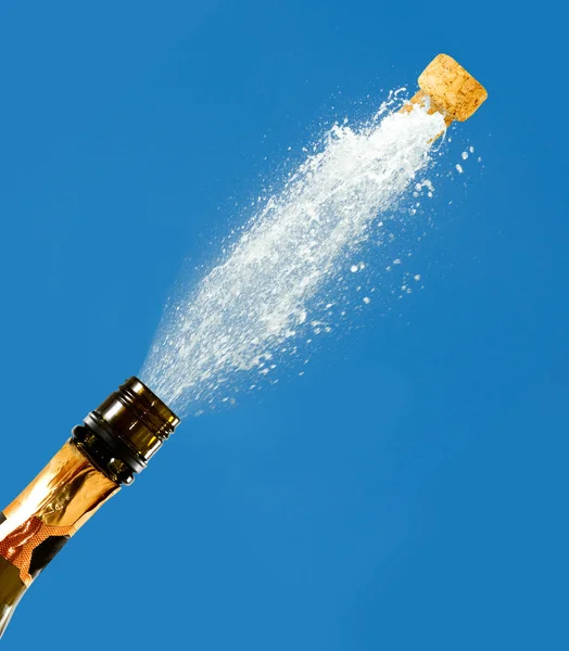 A bottle of champagne on a blue background — Stock Photo, Image