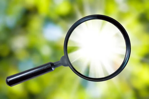 Magnifier on a green background close-up — Stock Photo, Image