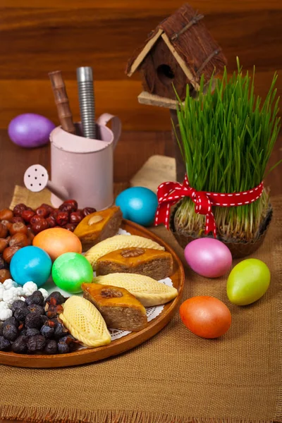 Colored eggs and Wheat springs — Stock Photo, Image