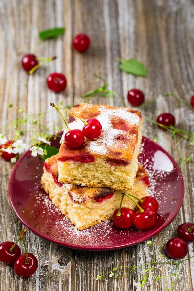 Summer Tart Cherry Cake with Powdered Sugar. Selective focus.