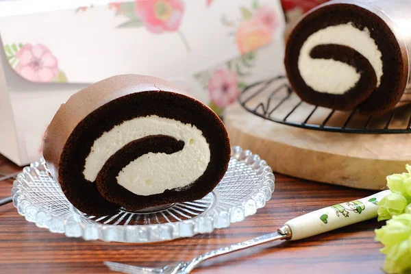 Creamy Chocolate Swiss Roll on Glass Plate