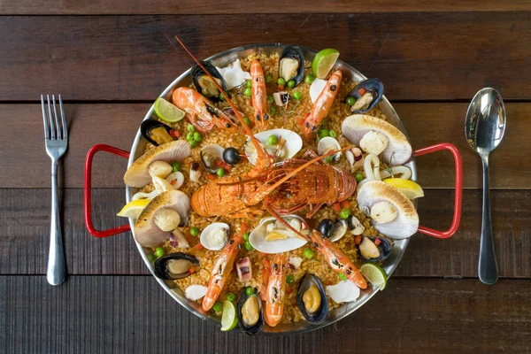 Paella with fresh lobster, scollops, mussels and prawn — Stock Photo, Image
