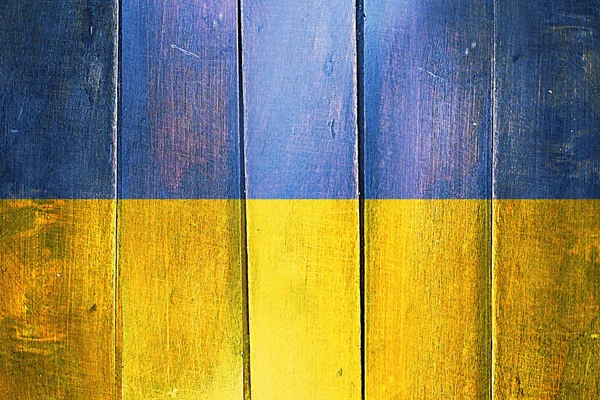 Vintage vlajka Ukrajiny na grunge dřevěný panel — Stock fotografie