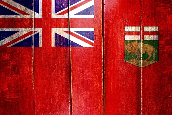 Bandeira de Manitoba vintage no painel de madeira grunge — Fotografia de Stock