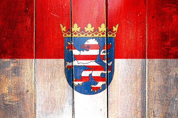 Vintage Hesse flag on grunge wooden panel — Stock Photo, Image