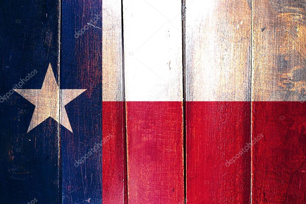 Vintage texas flag on grunge wooden panel