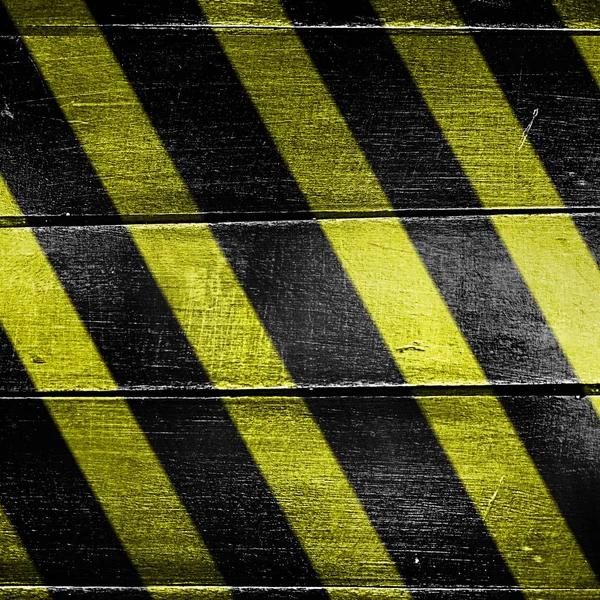 Zwarte en gele waarschuwing strepen — Stockfoto