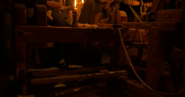 Wood turners in an ancient carpentry illuminated by candlelight — Stock Video