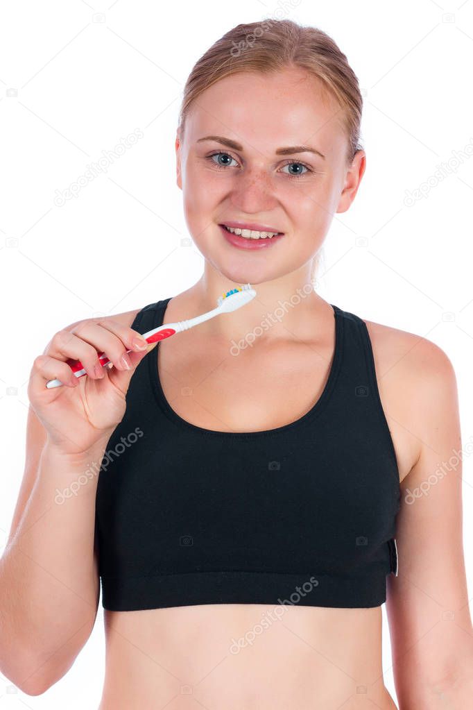 Girl with a toothbrush in her hand