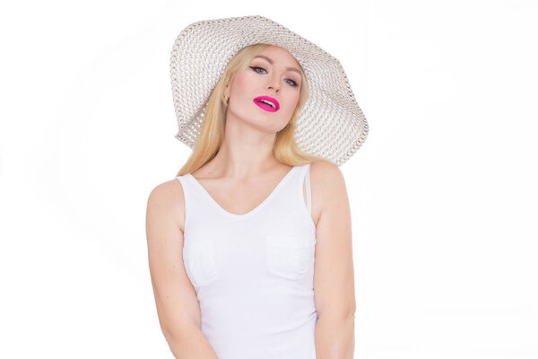 Beautiful young blond woman in a hat. Studio. Isolate. Concept - summer mood