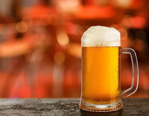 cold light beer glass mug in a pub