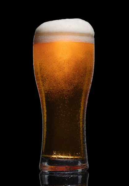Glass of beer isolated on black background.