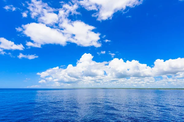 Open blue sea cumulus clouds — Stock Photo, Image