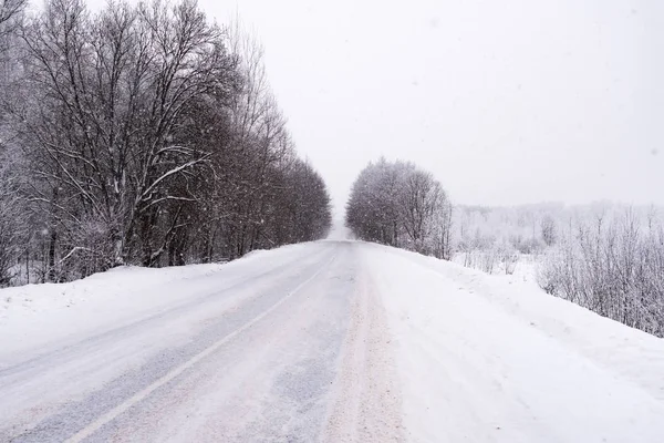 Winter road in the woods — Stock Photo, Image