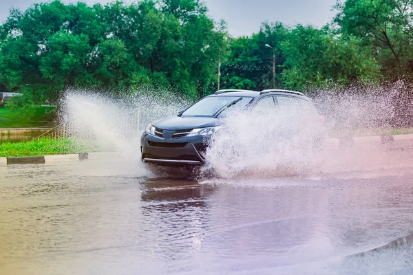 car rain puddle splashing water