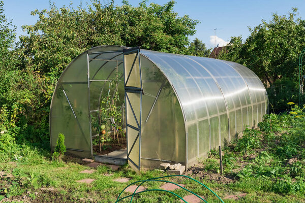 in the garden arched greenhouse
