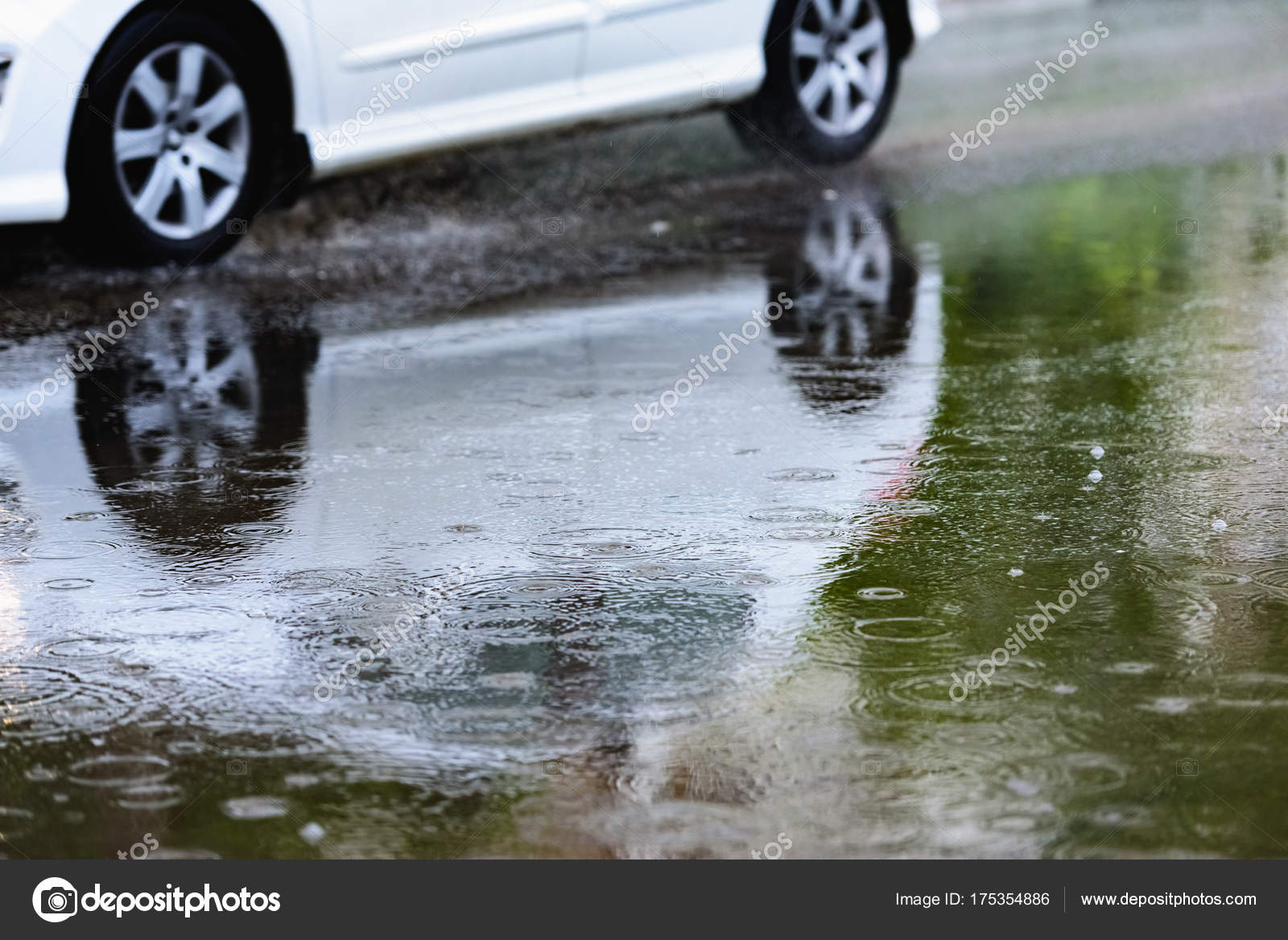 Car rain puddle splashing water toning Stock Photo by ©dbrus 175354886