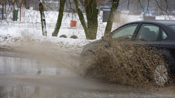 car rain puddle splashing water