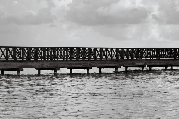 Old wooden pier goes to sea Royalty Free Stock Images