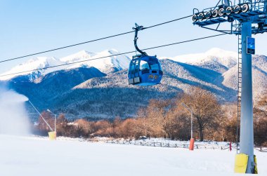 Bansko, Bulgaria - February 09, 2020: Winter ski resort Bansko, ski slope, people skiing and mountains view.