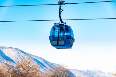 Bansko, Bulgaria - February 09, 2020: Winter ski resort Bansko, ski slope, people skiing and mountains view.