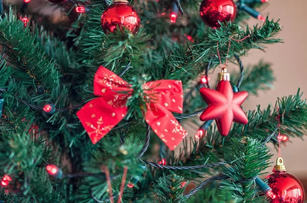 Christmas tree globe ornament. Baubles on fir tree branches. Star shape.