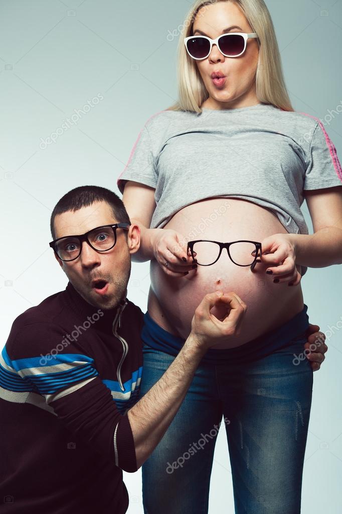 Funny and healthy pregnancy concept. Emotional portrait of happy hipsters Stock Photo by ©avgustino 124904170 Funny and healthy pregnancy concept. Emotional portrait of happy hipsters Stock Photo by ©avgustino 124904170