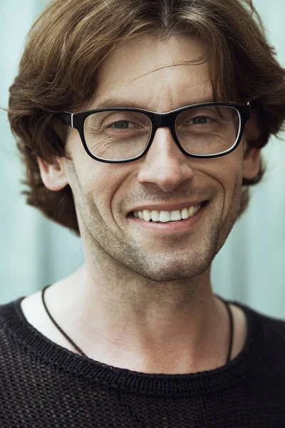 Eyewear concept. Portrait of romantic charismatic smiling man wearing eyewear — Stock Photo, Image