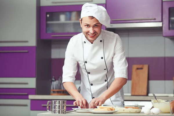 Tiramisu cooking concept. Portrait of smiling man in cook uniform — Stock Photo, Image