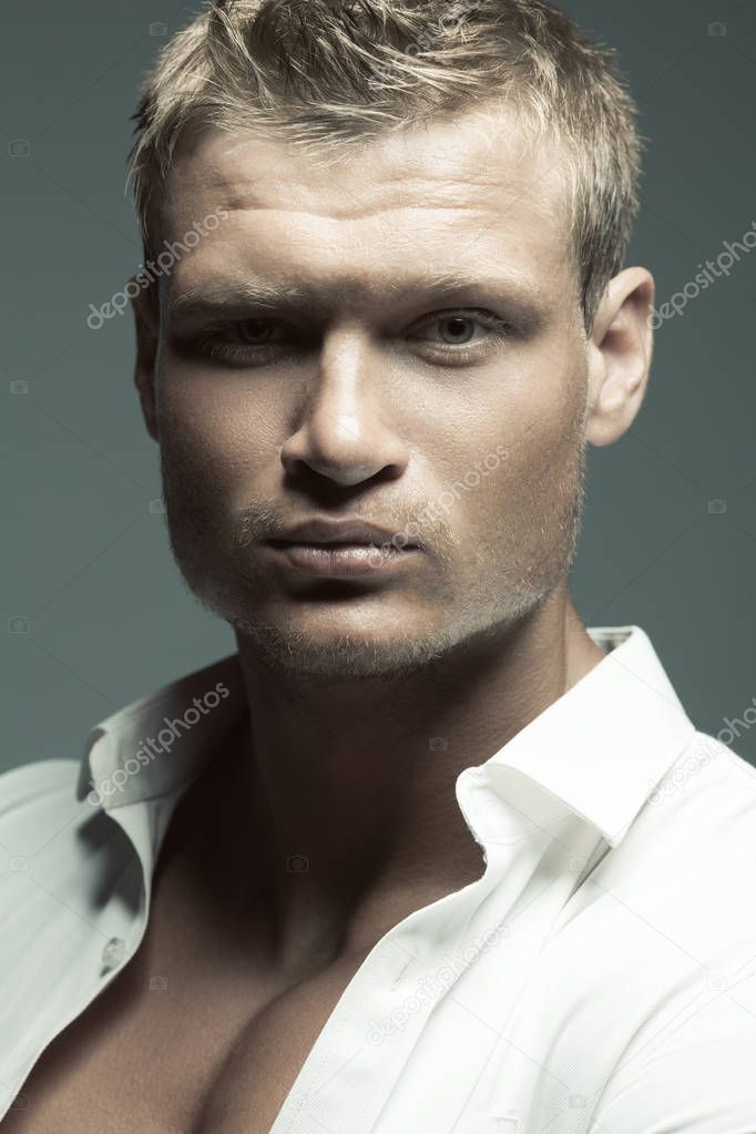 Male fashion, beauty concept. Portrait of brutal young man