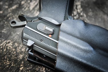 handgun in holster ready to firing position clipart