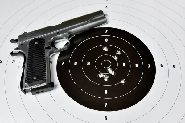 handgun and shooting target