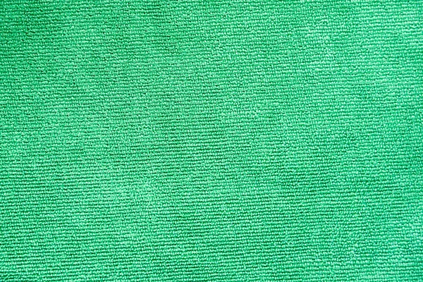 Primer plano plano de textura de tela de microfibra verde para fondo —  Fotos de Stock