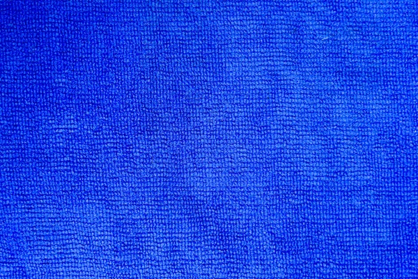 Primer plano plano de textura de tela de microfibra azul para fondo —  Fotos de Stock