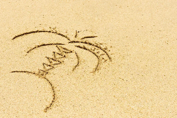 Image of palm tree  and wave drawing on sand. Sandy background.