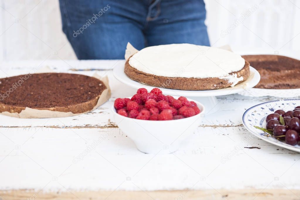 Cocoa Sponge Cake with Whipped Cream and Raspberries, cherries,