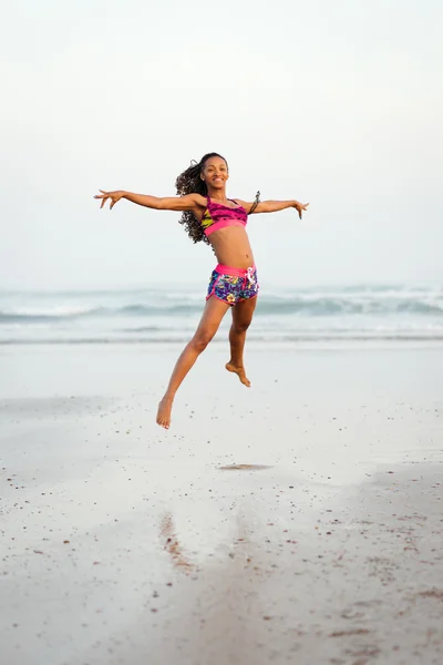 Graceful woman dancing and jumping at the beach — Stock Photo, Image