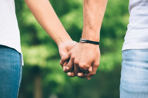 Lovers clasped hands — Stock Photo, Image