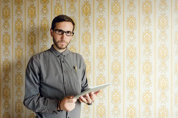 Young casual man working with digital tablet — Stock Photo, Image