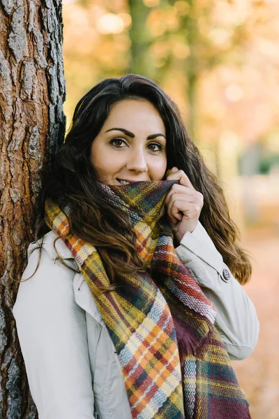 Portrait of young woman with warm scarf in autumn — Stock Photo, Image