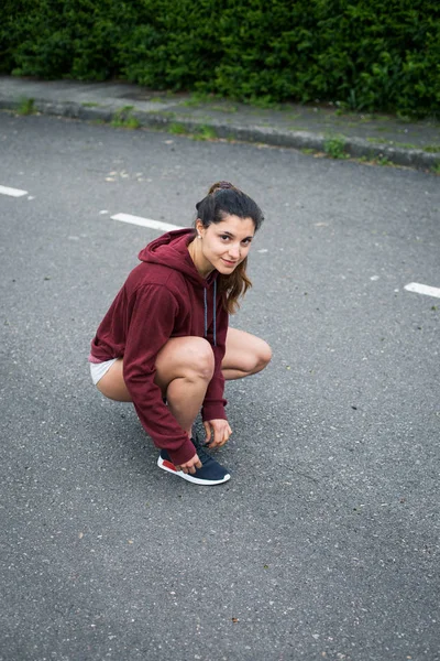 Confident Female Athlete Lacing Running Shoes Gettting Ready Training Asphalt — Stock Photo, Image