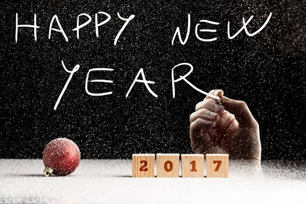 Male hand writing a Happy new year text — Stock Photo, Image