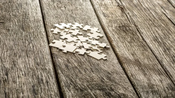 Pile of blank white puzzle pieces — Stock Photo, Image