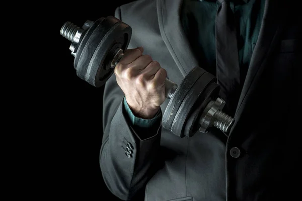 Businessman in formal suit lifting weights — Stock Photo, Image