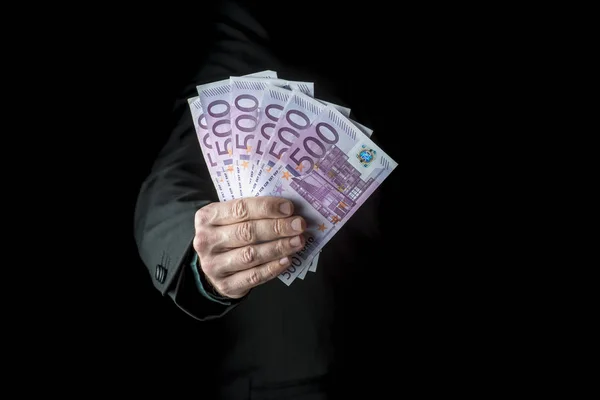 Businessman holding a fistful of 500 euro — Stock Photo, Image