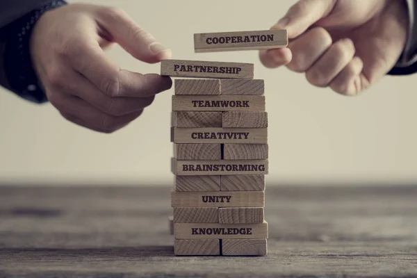 Stack of wooden dominoes with signs — Stock Photo, Image