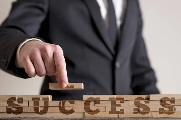 Man assembling word Success — Stock Photo, Image