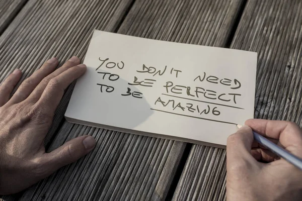 Hands of a man writing motivational quote — Stock Photo, Image