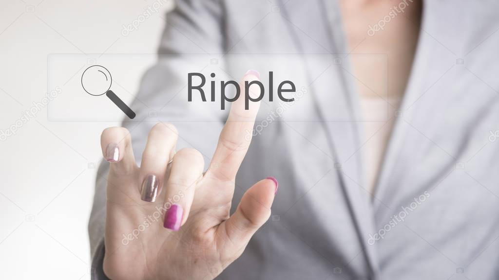Female hand touching a web search bar with Ripple text