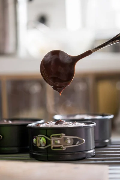 Baking tins with chocolate cake mix — Stock Photo, Image